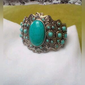 Ladies native style cuff bracelet with Turquoise stones. Perfect condition.